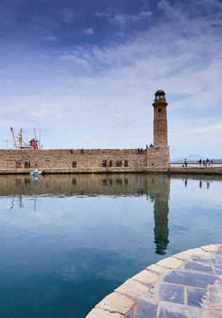 RETHYMNO, THE CRETE ISLAND, GREECE - MAY 30, 2019: Beautiful view at the venetian lighthouse in the harbour of Rethymnoのeditorial素材