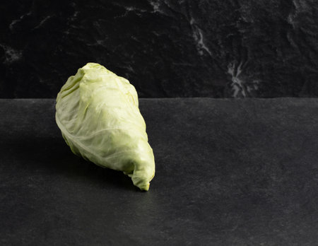 Cone head cabbage for dietary, vegan on a dark backgroundの写真素材