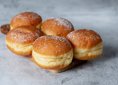 Austrian and german donuts - krapfen. Berliner with cream. On grey table. Selective focus.	Faschingskrapfenの写真素材