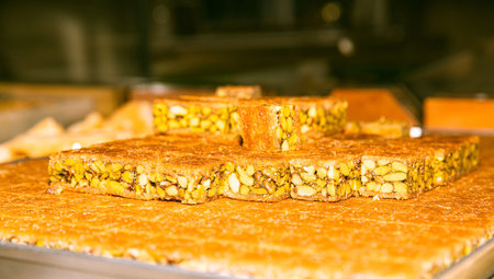 Middle Eastern pistachio nougat, delicious traditional sweet treat, squares of nutty crunchy...