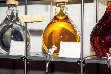 Colorful liquids in glass flasks on display, laboratory equipment, scientific conceptの写真素材