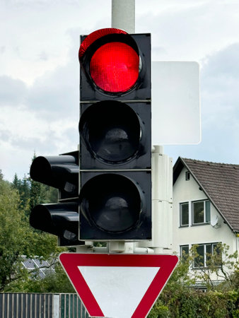 Traffic light with red signal in the city, closeup of photoの写真素材