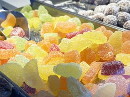 Colorful assorted gummy candies displayed in a market sweets collection.の写真素材