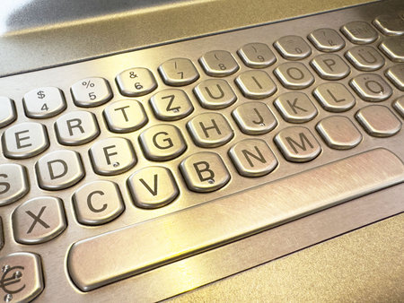 Metallic german keyboard with hexagonal keys in close-up view.