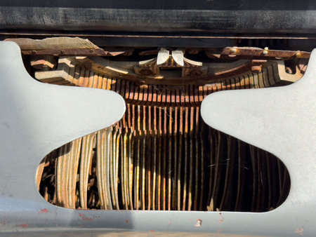 Vintage typewriter mechanism with exposed metal and keys.の写真素材