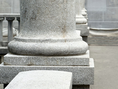 Close-up of stone columns in historical building exterior architecture.の写真素材