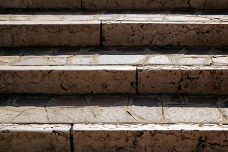 Rustic stone steps with natural texture and weathered appearance.の写真素材