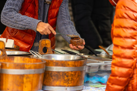 Street food market: asian vendors serving traditional dishes.の写真素材