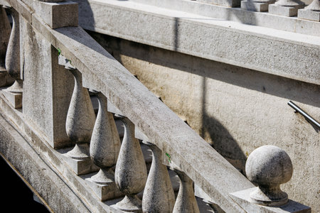 Detailed stone balustrade with shadow contrast on a sunny day.の写真素材