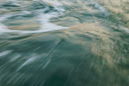 Dynamic motion of ocean waves with blurred water surface.の写真素材