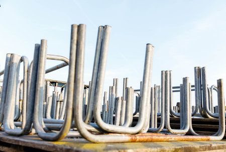 Metal pipe structures in outdoor industrial setting.