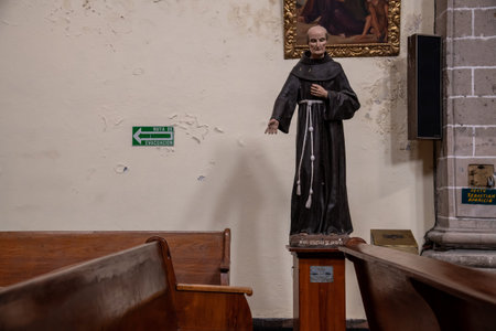 MEXICO CITY - JULY 20, 2018: Inside a church with a monk statueのeditorial素材