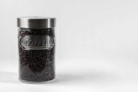 Coffee beans in a glass jar with lidの写真素材