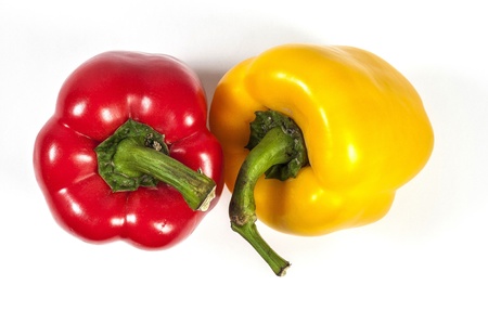 red and yelllow bell pepper isolated in white backgroundの写真素材