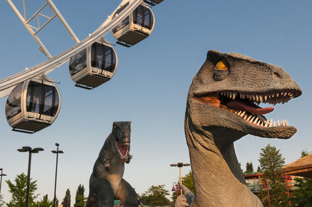 Amusement park with dinosaur and ferris wheelのeditorial素材