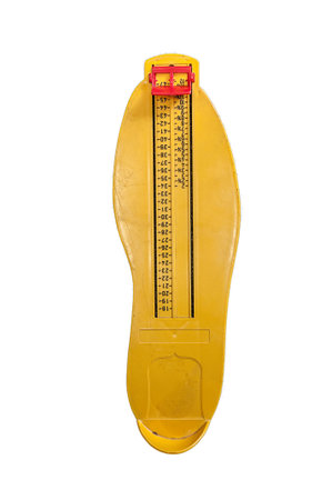 Uellow feetsize measuring tool on white backgroundの写真素材