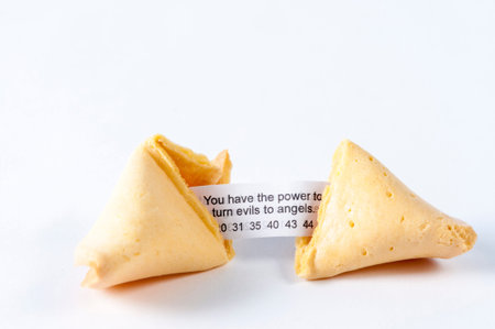 Cracked open fortune cookie revealing the luck inside