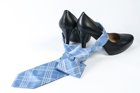 Neck tie tied over a high heel shoeの写真素材
