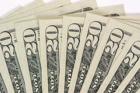 Pile of 20 US dollar bill in white back ground