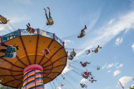 Flying chair ride in motion on sunny dayのeditorial素材