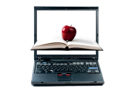 Book, apple, coming out from a laptop, on white backgroun