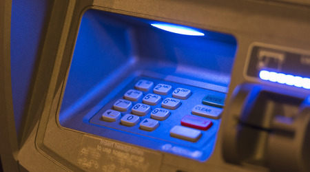 Blue light on ATM machiine key padの写真素材