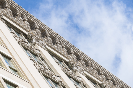 Classical building ornaments details with sky in back groundの写真素材