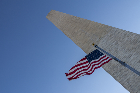Flag waving infront of washington monumentの写真素材