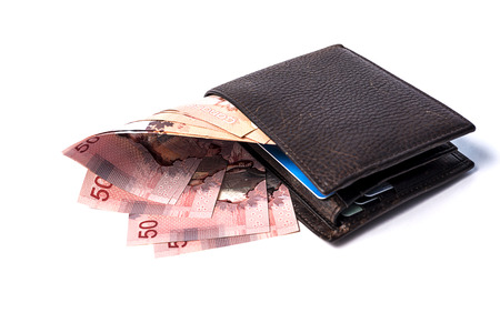 Folded wallet with 50$ bills sticking outの写真素材