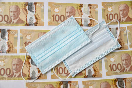 Canadian 100 dollar bill lined up on white back groundのeditorial素材
