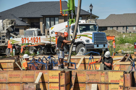 New construction of houses pouring fresh concrete