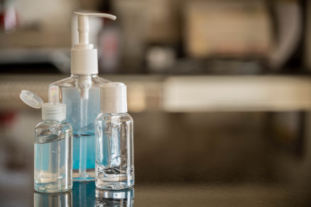 Different shapes of hand sanitizer bottles with blurry back ground.
