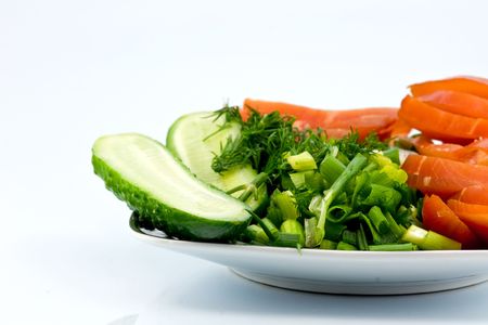 Sliced smoked chicken and vegetables on square porcelain plate
の写真素材