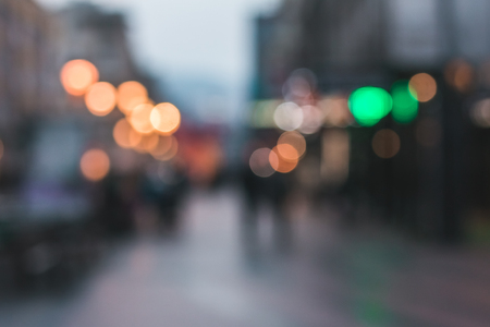 Blur abstract people background, unrecognizable silhouettes of people walking on a streetの写真素材