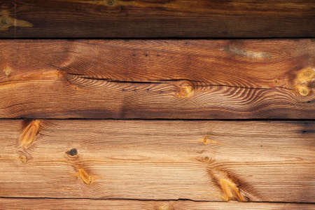 Background from old wood darkened by the passage of timeの写真素材