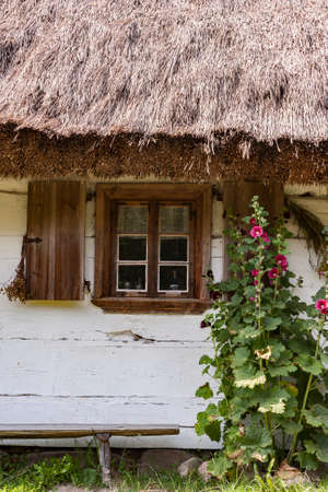 Rural architecture window. Windows on old wooden houseの写真素材