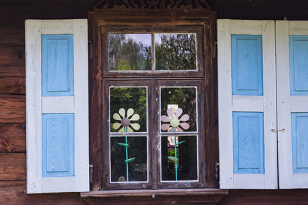 Rural architecture - window. Windows on old wooden houseの写真素材