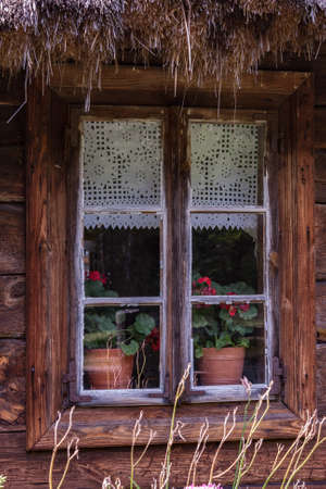 Rural architecture - window. Windows on old wooden houseの写真素材