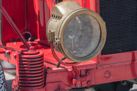 Kerosene lamp, old brass car headlight in oldtimer