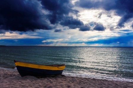 Autumn. Storm clouds over the horizon at sea during sunsetの写真素材