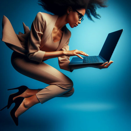 Beautiful african american woman in business suit with laptop.の素材