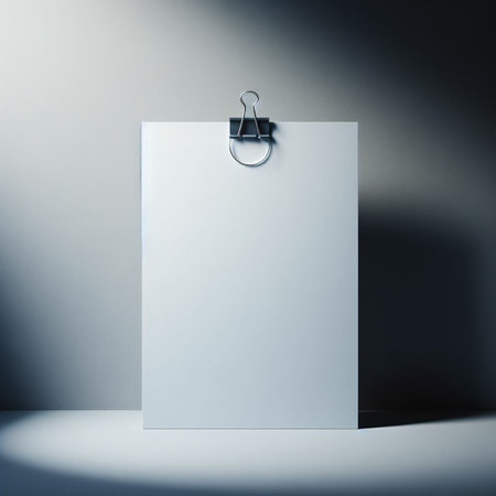 Blank paper sheet hanging on a metal clip. 3d renderingの素材