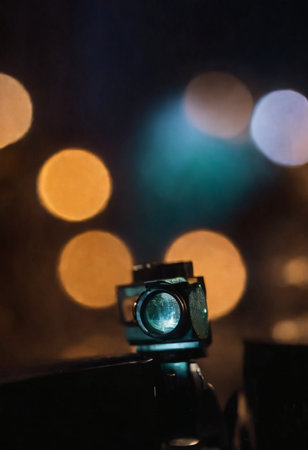 Close-up view of a vintage movie projector with bokeh backgroundの素材