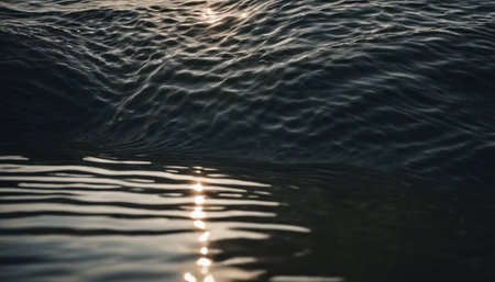 Blue sea water surface with sun reflection. Close up view of sea surface.の素材