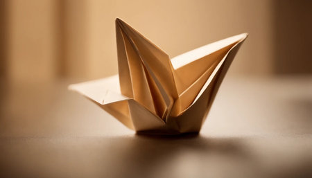 Paper origami boat on a brown background. The concept of origami.の素材