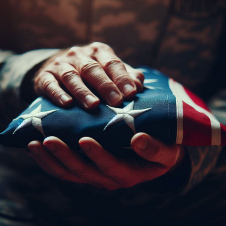 Closeup of a man's hands holding an american flag.の素材
