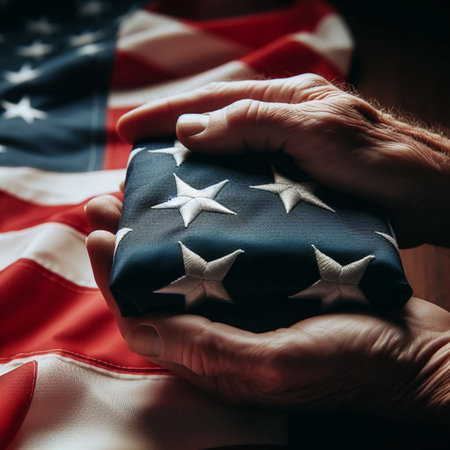 American flag and hands holding a gift on a wooden background. Selective focus.の素材