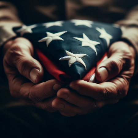 American Flag in the hands of an elderly man. Selective focus.の素材