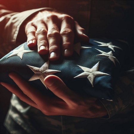 Female soldier hands holding american flag. Selective focus. Toned.の素材