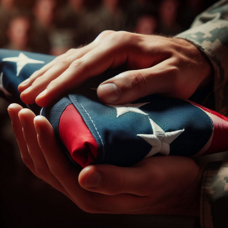 Close-up of a soldier's hands holding an American flag.の素材
